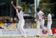 Cricket - Sri Lanka v South Africa -Second Test Match - Colombo, Sri Lanka - July 20, 2018 - South Africa's Kagiso Rabada (L) appeals for an unsuccesful LBW wicket for Sri Lanka's Danushka Gunathilaka (C). REUTERS/Dinuka Liyanawatte