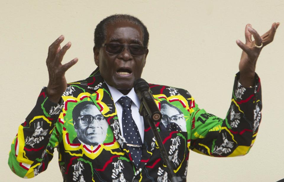 FILE - In this Saturday, Dec, 17, 2016 file photo, Zimbabwean President Robert Mugabe addresses people at an event before the closure of his party's 16th Annual Peoples Conference in Masvingo, south of the capital Harare. Mugabe celebrates his 93 birthday Tuesday, Feb. 21, 2017, with celebrations set for Saturday. (AP Photo/Tsvangirayi Mukwazhi, File)