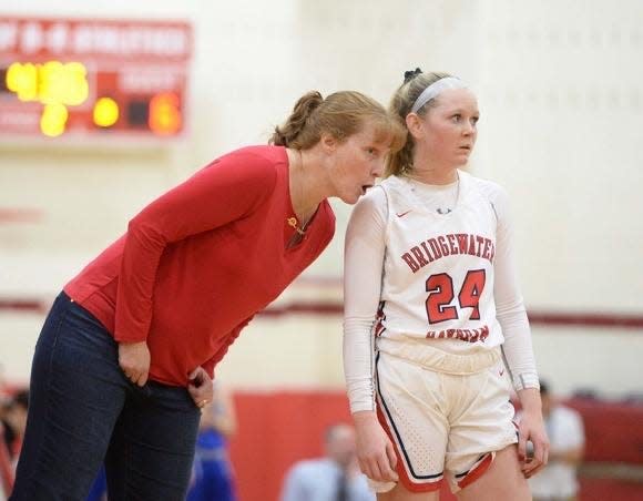 Bridgewater-Raynham coach Cheryl Seavey (left) gives instructions to Kenzie Matulonis during a 2019/20 game.