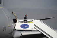 French President Emmanuel Macron disembarks from an Airbus A330 MRTT to attend the 53rd International Paris Air Show at Le Bourget Airport near Paris, France, Monday June 17, 2019. The world's aviation elite are gathering at the Paris Air Show with safety concerns on many minds after two crashes of the popular Boeing 737 Max. (Benoit Tessier/Pool via AP)