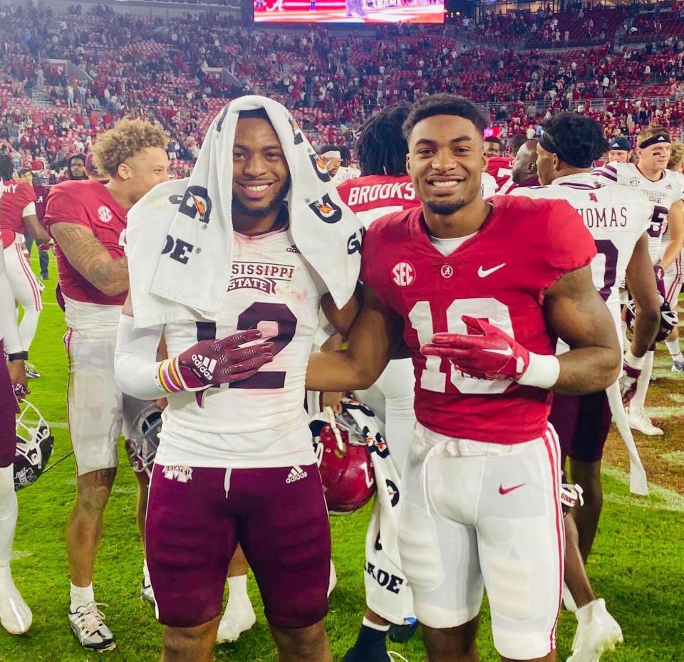 Mississippi State football's Shawn Preston Jr. takes a photo with his younger brother, Alabama's Shazz Preston, after a game at Bryant-Denny Stadium in 2022.