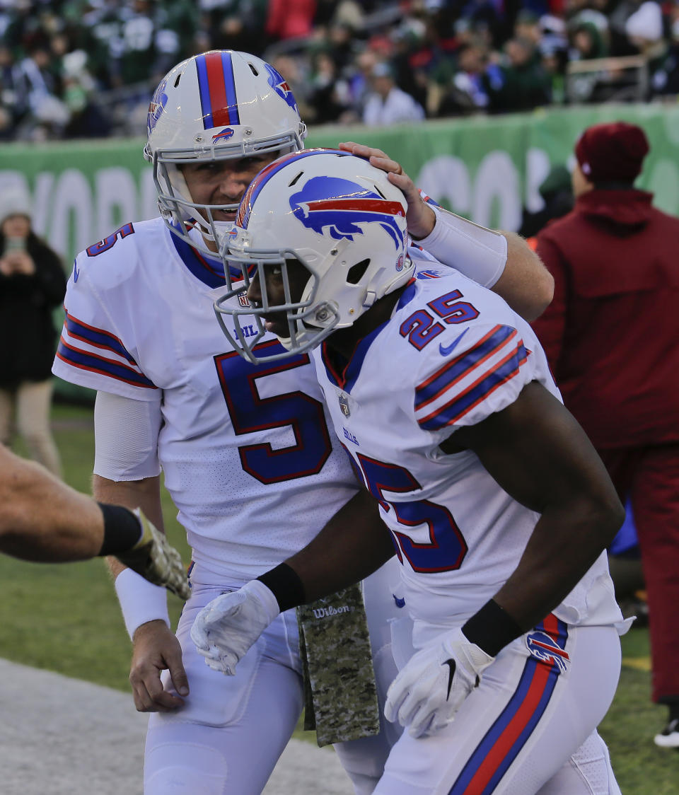 Buffalo Bills running back LeSean McCoy (25) is congratulated by quarterback Matt Barkley (5) after scoring a touchdown against the New York Jets during the first quarter of an NFL football game, Sunday, Nov. 11, 2018, in East Rutherford, N.J. (AP Photo/Seth Wenig)