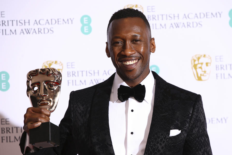 Actor Mahershala Ali poses for photographers backstage with the Best Supporting Actor award for his role in the film ‘Green Book’ at the BAFTA awards in London, Sunday, Feb. 10, 2019. (Credit: Joel C Ryan/Invision/AP)