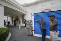 <p>Workmen wait for outside the West Wing of the White House in Washington, Friday, Aug. 11, 2017, during renovations while President Donald Trump is spending time at his golf resort in New Jersey. (AP Photo/J. Scott Applewhite) </p>