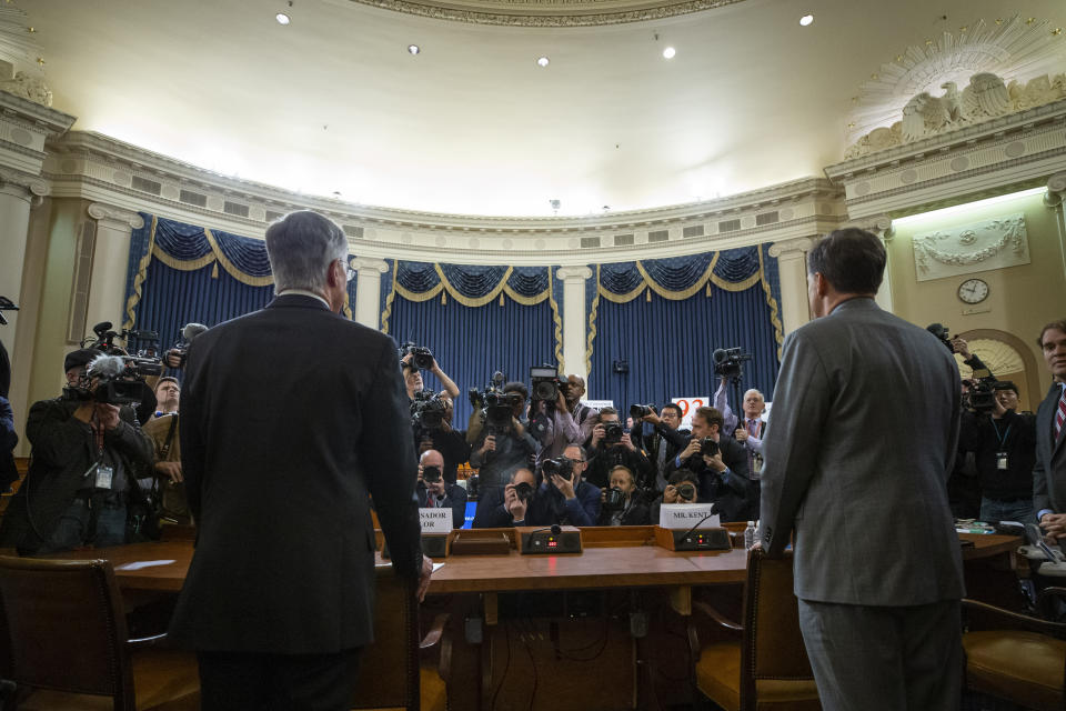 Top U.S. diplomat in Ukraine William Taylor, left, and career Foreign Service officer George Kent arrive to testify during an impeachment hearing of the House Intelligence Committee on Capitol Hill, Wednesday Nov. 13, 2019 in Washington. (AP Photo/Alex Brandon)