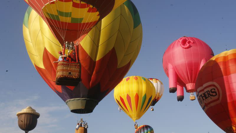 Balloons ascend from Fox Field during the Freedom Festival hot-air balloon launch in Provo, Utah July 1, 2006. Utahn, Kimberly Whiteman is heading to the world championship for hot air ballooning.