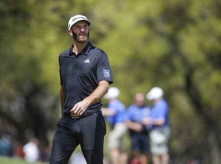 Mar 21, 2018; Austin, TX, USA; Dustin Johnson of the United States on the first hole during the first round of the WGC - Dell Technologies Match Play golf tournament at Austin Country Club. Mandatory Credit: Erich Schlegel-USA TODAY Sports