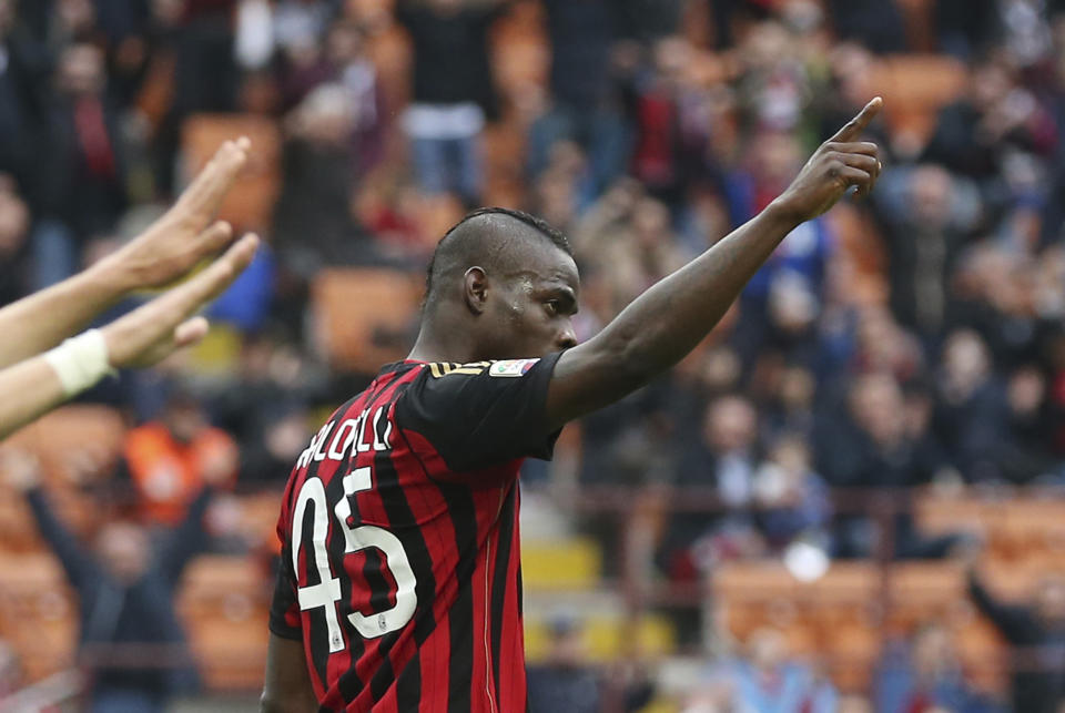 AC Milan forward Mario Balotelli celebrates after scoring during the Serie A soccer match between AC Milan and Livorno at the San Siro stadium in Milan, Italy, Saturday, April 19, 2014. (AP Photo/Antonio Calanni)