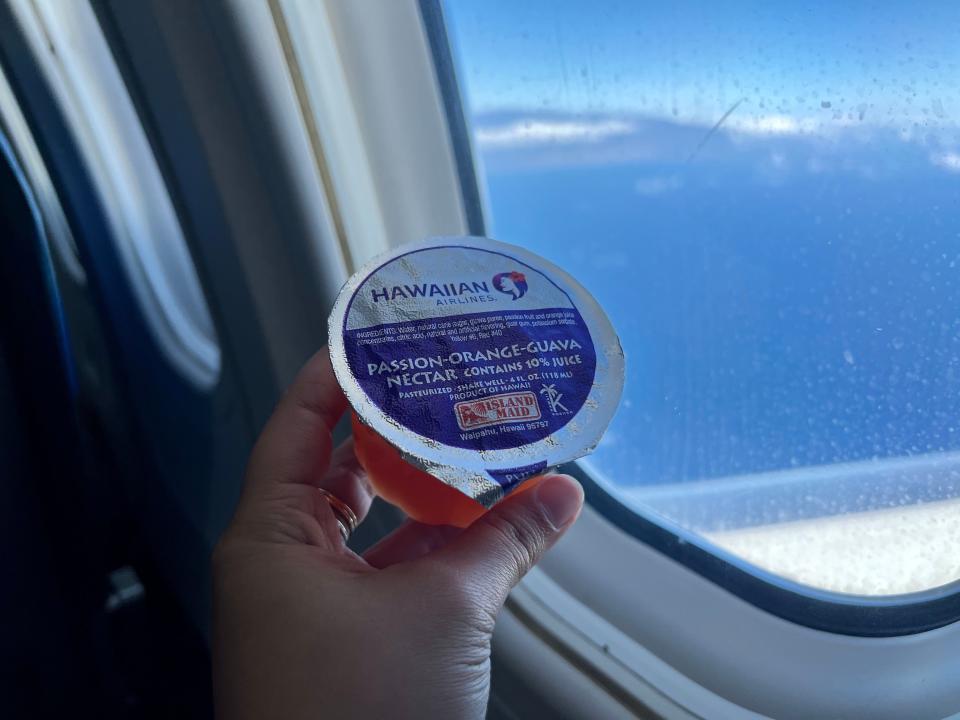 a jelly cup on a hawaiian airlines flight