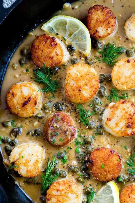<p>The Recipe Critic</p><p>Pan-seared scallops with lemon caper sauce is an elegant yet easy dish that is perfect for special occasions or any day of the week. The caramelized scallops and the delicious sauce is made all in one pan!</p><p><strong>Get the recipe: <a href="https://therecipecritic.com/pan-seared-scallops/" rel="nofollow noopener" target="_blank" data-ylk="slk:Lemon Butter Scallops;elm:context_link;itc:0;sec:content-canvas" class="link rapid-noclick-resp">Lemon Butter Scallops</a></strong></p>