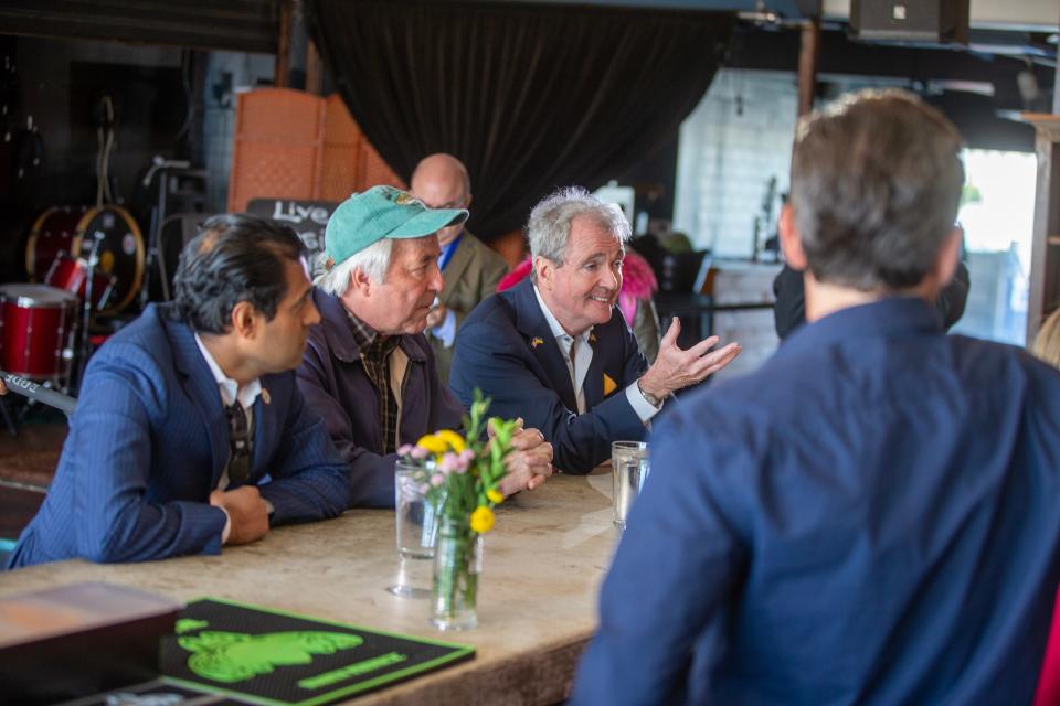 (right) Gov. Phil Murphy speaks to the staff of Low Dive as visits small businesses on the Asbury Park boardwalk with (left) Senator Vin Gopal and (center) Asbury Park Mayor John Moor to call attention to his proposal to create a "boardwalk fund" as part of the state budget in Asbury Park, NJ Thursday, May 25, 2023. The fund would help towns repair their boardwalks, a move he thinks is vital to economic development.