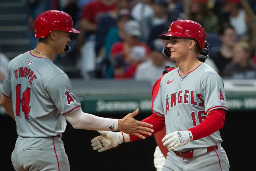 Los Angeles Angels’ Logan O’Hoppe (14) congratulates Micky Moniak, right, after his three-run home run off Cleveland Guardians starting pitcher Tanner Bibee during the inning of a baseball game in Cleveland Friday, May 3, 2024. (AP Photo/Phil Long)
