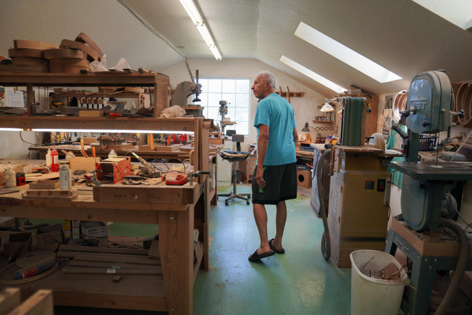 Mike Dulak walks through his mandolin workshop near his home in Rocheport, Mo., Friday, Sept. 8, 2023. Dulak does not associate with any religious group and self-identifies as "nothing in particular" when asked about his beliefs. He is part of the largest group of nonbelievers in the United States today, as nearly one in six adults claim the label "nothing in particular" according to the Associated Press- NORC Center for Public Affairs Research. (AP Photo/Jessie Wardarski)