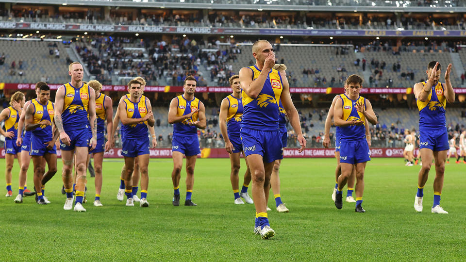 The West Coast Eagles walk off the ground.