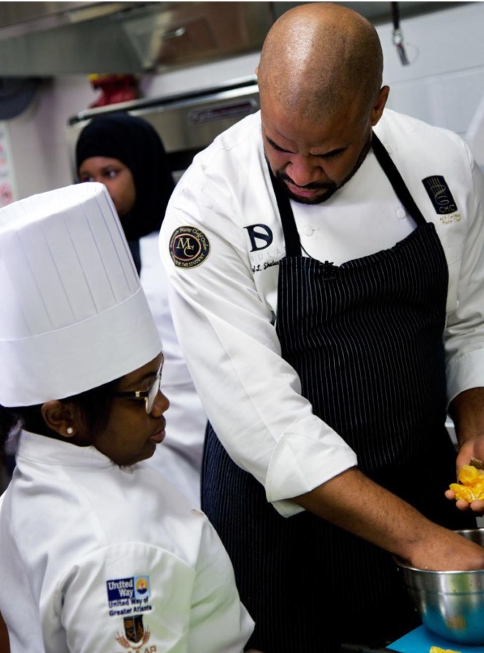 Certified master chef Daryl Shular, shown working with a student, leads the Shular Institute. The group is planning Brigade MKE culinary classes, starting with a boot camp-type session for 14- to 18-year-olds.