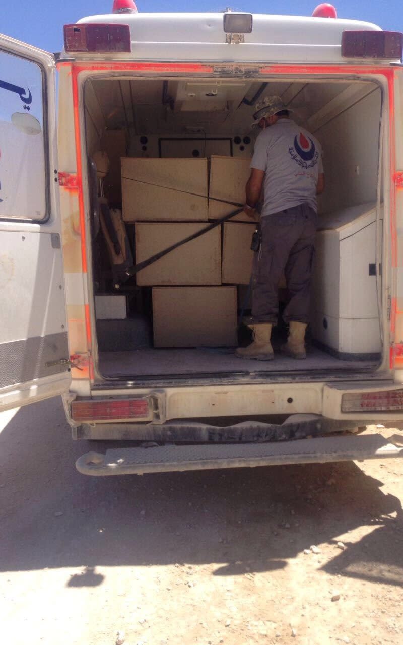  A Hezbollah ambulance carrying the coffins of bodies of Nusra Front fighters in Labwe, Lebanon - Credit: Reuters handout 