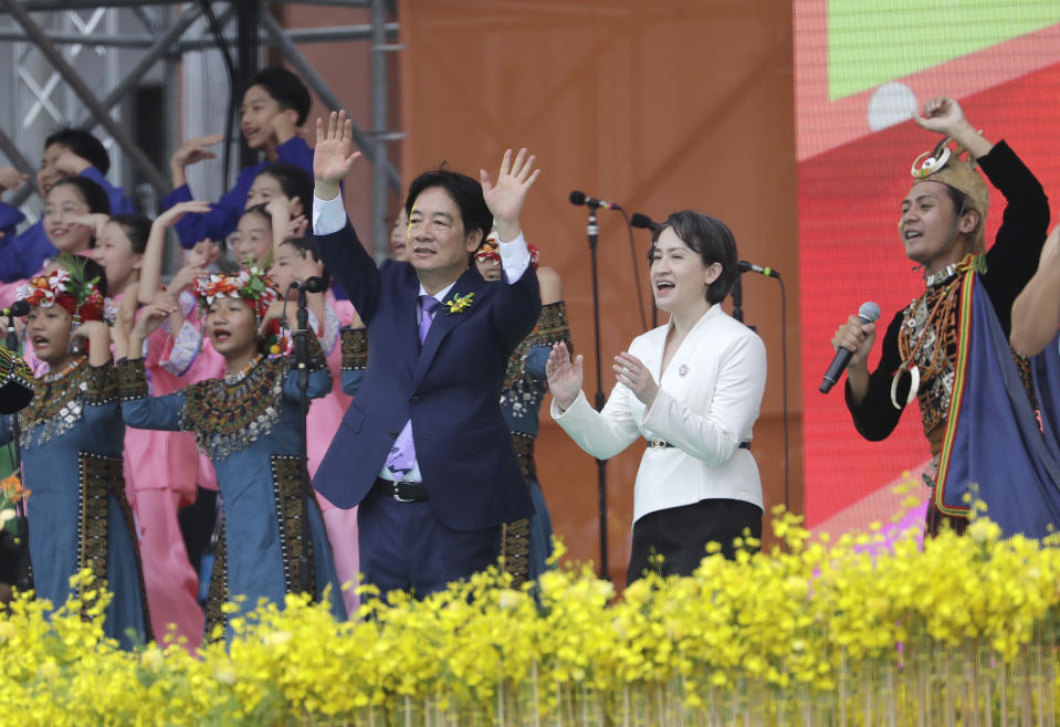 New Taiwan's President Lai Ching-te, center left, and Vice President Hsiao Bi-khim, center right, cheer with performers during Lai''s inauguration ceremony in Taipei, Taiwan, Monday, May 20, 2024 (AP Photo/Chiang Ying-ying)