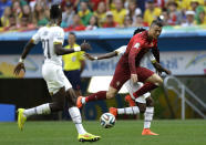 FILE - Portugal's Cristiano Ronaldo takes on the Ghana defence during the group G World Cup soccer match between Portugal and Ghana at the Estadio Nacional in Brasilia, Brazil, Thursday, June 26, 2014. (AP Photo/Martin Mejia, File)