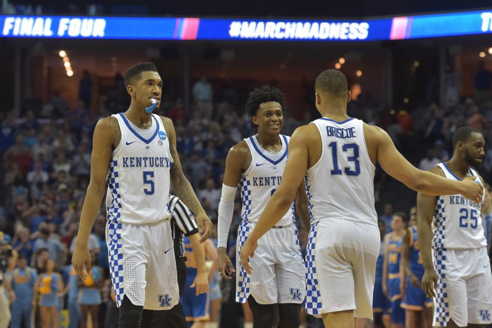 Malik Monk (5) and De'Aaron Fox (0) celebrate with guard Isaiah Briscoe (13) after defeating the UCLA Bruins in the 2017 NCAA Tournament.