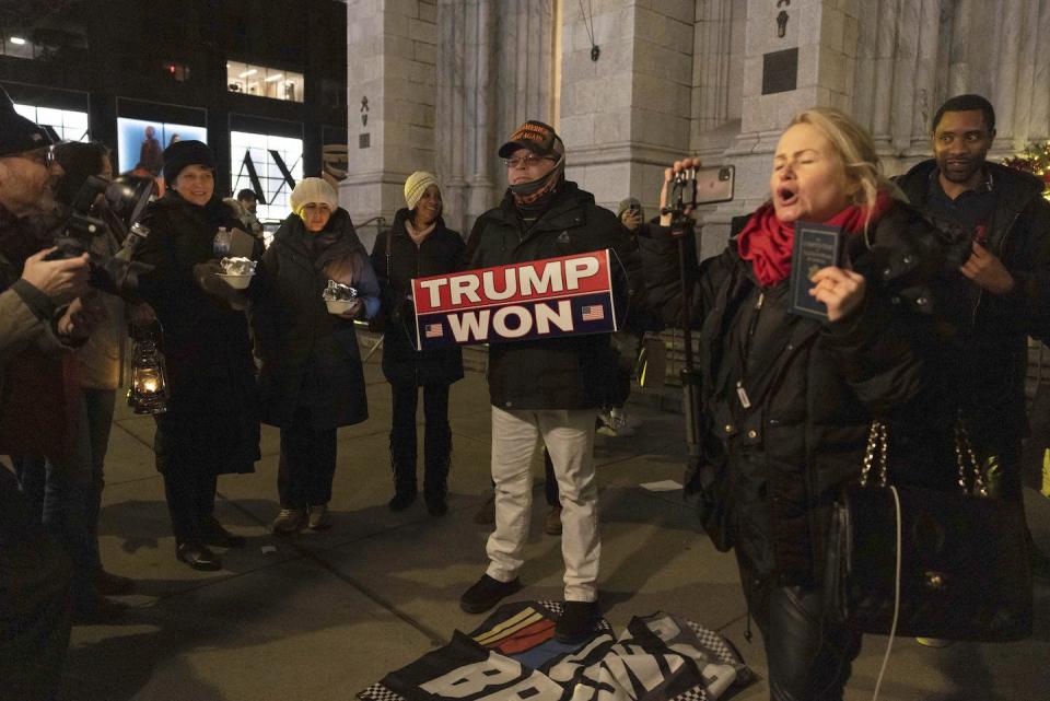 Trump supporters and members of the far-right group Proud Boys gather during a ‘Justice for January 6th Vigil’ in New York on Jan. 6, 2022. <a href="https://newsroom.ap.org/detail/CapitolRiotAnniversary/17950ea7bc0a4162b00f0b97ba71a308/photo?Query=trump%20capitol%20january%206&mediaType=photo&sortBy=arrivaldatetime:desc&dateRange=Anytime&totalCount=106&currentItemNo=29" rel="nofollow noopener" target="_blank" data-ylk="slk:AP Photo/Yuki Iwamura;elm:context_link;itc:0;sec:content-canvas" class="link ">AP Photo/Yuki Iwamura</a>