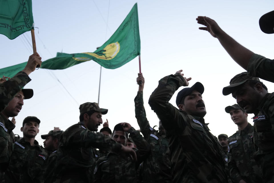 Members of an Iraqi Shiite militant group attend the funeral of an fighter who was killed in a U.S. airstrike Province, in Baghdad, Iraq, Thursday, Jan. 4, 2024. The Popular Mobilization Force - a coalition of militias that is nominally under the control of the Iraqi military - announced in a statement that its deputy head of operations in Baghdad, Mushtaq Taleb al-Saidi, or "Abu Taqwa," had been killed in the strike. (AP Photo/Hadi Mizban)