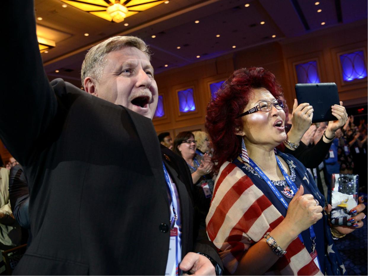 Pennsylvania Congressman Rick Saccone and his wife Yong cheer as they listen to remarks during the Conservative Political Action Conference (CPAC), 22 February 2017: REUTERS/Mike Theiler