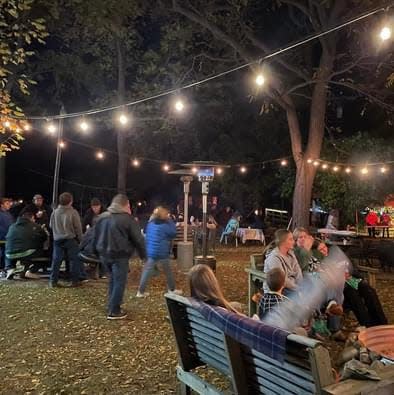 People walking through the Sanilac County Historic Village and Museum's Haunted Village event on Oct. 16, 2022