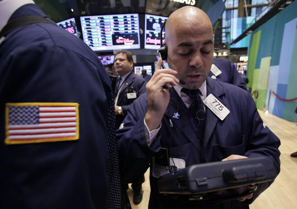 Trader Fred Demarco works on the floor of the New York Stock Exchange Wednesday, Oct. 3, 2012. Stocks are mostly higher in early trading on Wall Street Wednesday after a measure of private sector hiring came in better than economists were expecting. (AP Photo/Richard Drew)