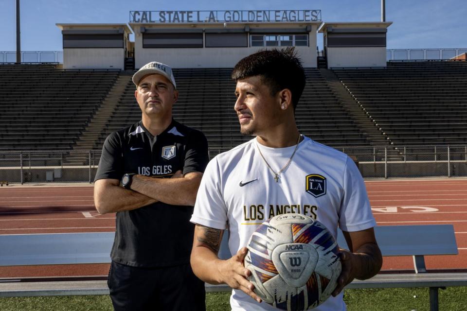 Cal State L.A. men's soccer coach Michael Erush, left, and Bryan Ortega stand near one another.