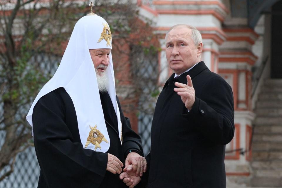 Russian President Vladimir Putin and Russian Orthodox Church Patriarch Kirill (L) talking during an event at the Monument to Minin and Pozharsky on the Red Square, on Nov. 4, 2023. (Gavriil Grigorov/POOL/AFP via Getty Images)