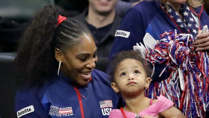 United States' Serena Williams sits with her daughter, Alexis Olympia Ohanian Jr., as they look on during a Fed Cup qualifying tennis match Saturday, Feb. 8, 2020, in Everett, Wash.