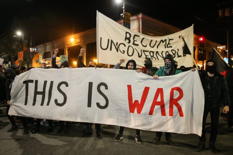 People protesting Milo Yiannopoulos take to the streets in Berkeley on Wednesday night.