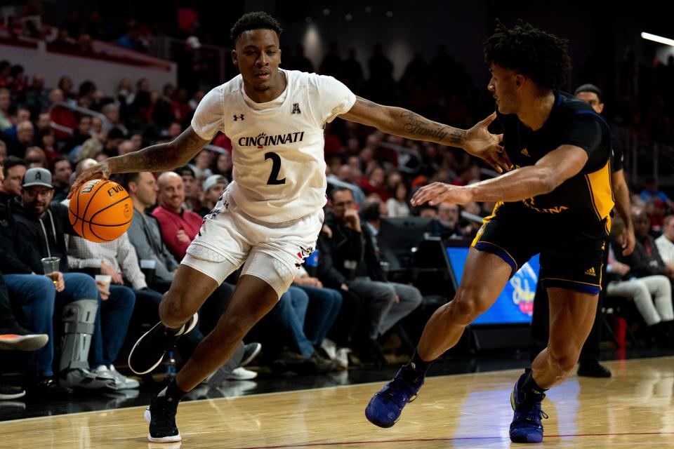 Cincinnati Bearcats guard Landers Nolley II  drives on East Carolina guard Quentin Diboundje  Wednesday night at Fifth Third Arena. Nolley finished with a team-leading 20 points with 10 rebounds.