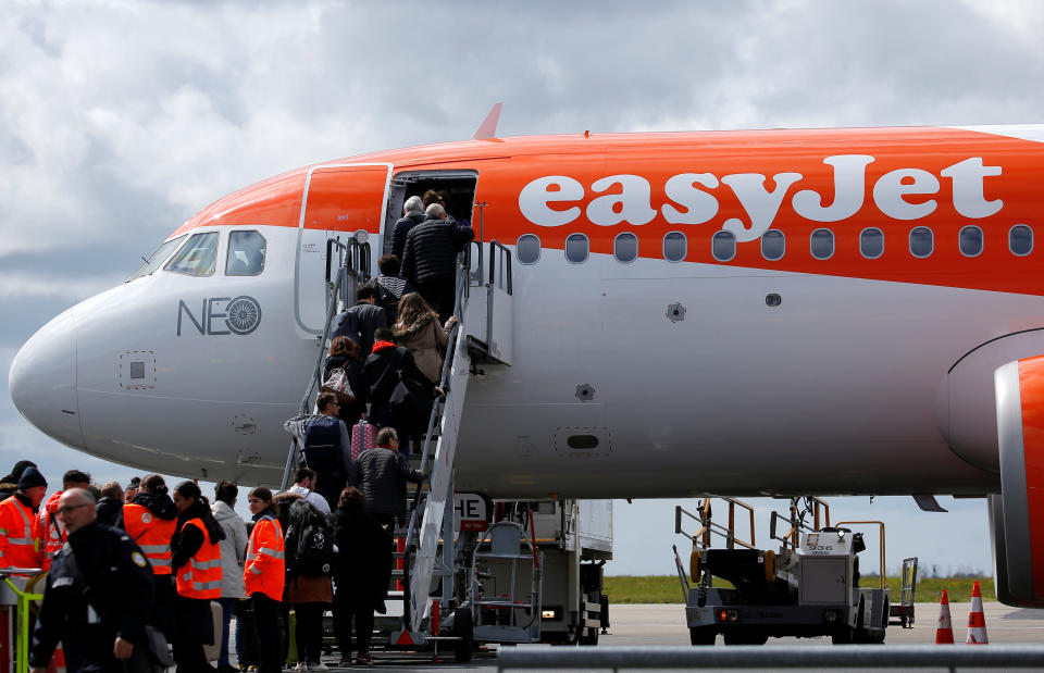 Passengers board an easyJet plane at the Nantes-Atlantique airport in Bouguenais near Nantes, France, April 4, 2019. REUTERS/Stephane Mahe