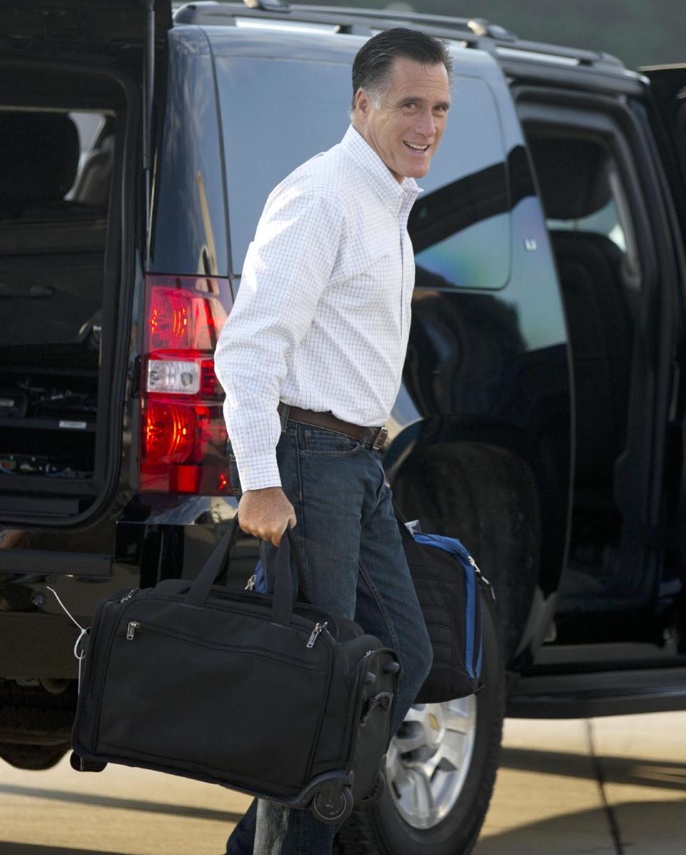 Republican presidential candidate, former Massachusetts Gov. Mitt Romney boards his campaign plane for an event in Iowa on Friday, Sept. 7, 2012 in Portsmouth, N.H. (AP Photo/Evan Vucci)