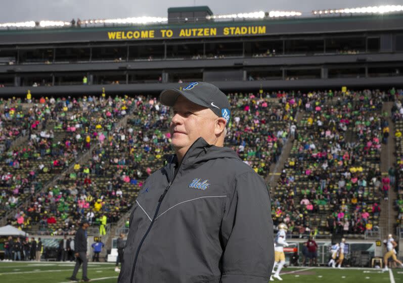 UCLA head coach Chip Kelly walks the sidelines at Autzen Stadium