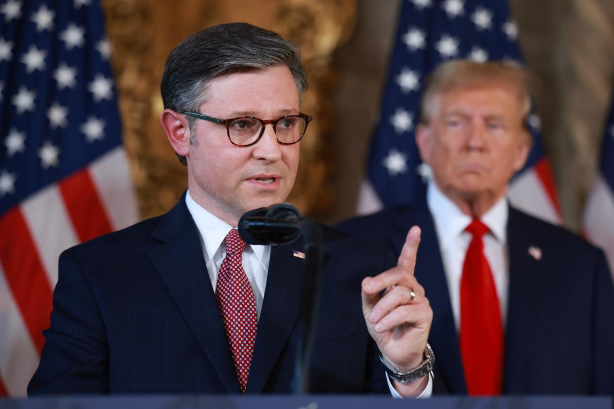 Republican presidential candidate former President Donald Trump listens as Speaker of the House Mike Johnson (R-LA) speaks during a press conference at Mr. Trump's Mar-a-Lago estate on April 12, 2024, in Palm Beach, Florida. They spoke about "election integrity," which has been one of the former president's top issues.