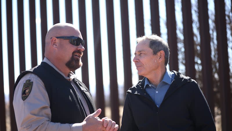 Rep. John Curtis, R-Utah, visits with an Arizona law enforcement officer at the U.S.-Mexico border on Thursday, Feb. 8, 2024.