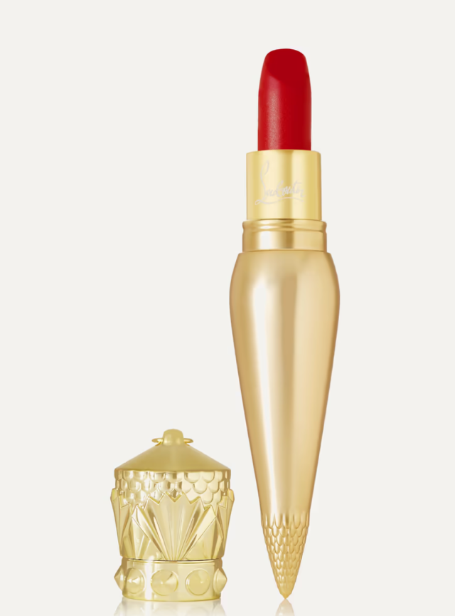 A gold-tone vial of red lipstick which can be worn as a necklace.