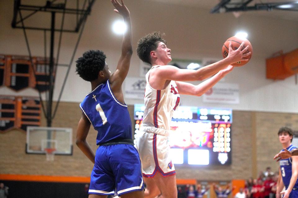 Pleasant Plains' Cooper Schallenberg goes up for a layup against Alton Marquette in the Class 2A Beardstown Sectional semifinals on Tuesday, Feb. 27, 2024.