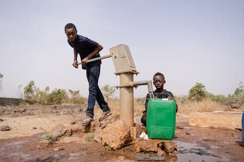   <span class="attribution"><a class="link " href="https://www.shutterstock.com/image-photo/two-african-boys-busy-filling-water-2172736903" rel="nofollow noopener" target="_blank" data-ylk="slk:Riccardo Mayer/Shutterstock;elm:context_link;itc:0;sec:content-canvas">Riccardo Mayer/Shutterstock</a></span>