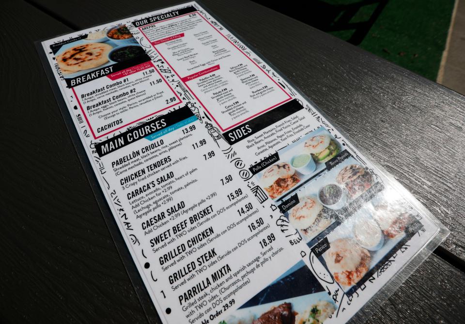 The menu at Caracas House, a new Venezuelan food truck that offers authentic food, at Metro Eats in Springfield on Friday, Sept. 29, 2023.