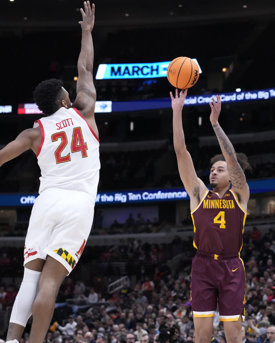 Minnesota's Braeden Carrington (4) shoots as Maryland's Donta Scott defends during the first half of an NCAA college basketball game at the Big Ten men's tournament, Thursday, March 9, 2023, in Chicago. (AP Photo/Charles Rex Arbogast)