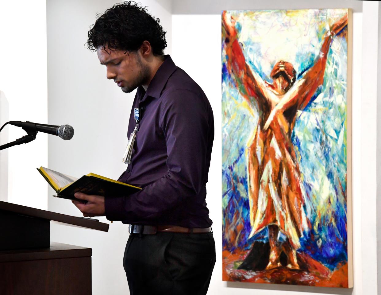 Hendrick Medical Center chaplain Wesley Erickson reads a prayer during the Abilene Interfaith Council's National Day of Prayer program Thursday at The Center for Contemporary Arts.