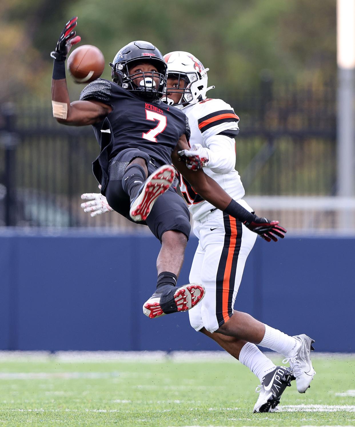 Massillon's Freddie Lenix Jr. breaks up a pass intended for McKinley receiver Tra'Sean Foster in the first half at Tom Benson Stadium Saturday, Oct. 23, 2021.