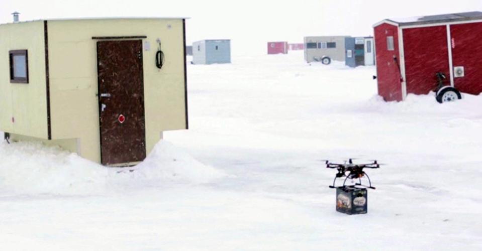 In this Jan. 16, 2014 image from video provided by Lakemaid Beer, a mini-drone lands with a 12-pack of beer for ice fishing anglers on Minnesota’s Lake Mille Lacs. Lakemaid president Jack Supple said he thought Amazon's package delivery plan would better be applied on a wide open frozen lake where ice anglers are manning their fishing holes in tiny shanties, but the Federal Aviation Administration heard him talking about his plans on the radio and grounded future deliveries. (AP Photo/Courtesy Lakemaid Beer)