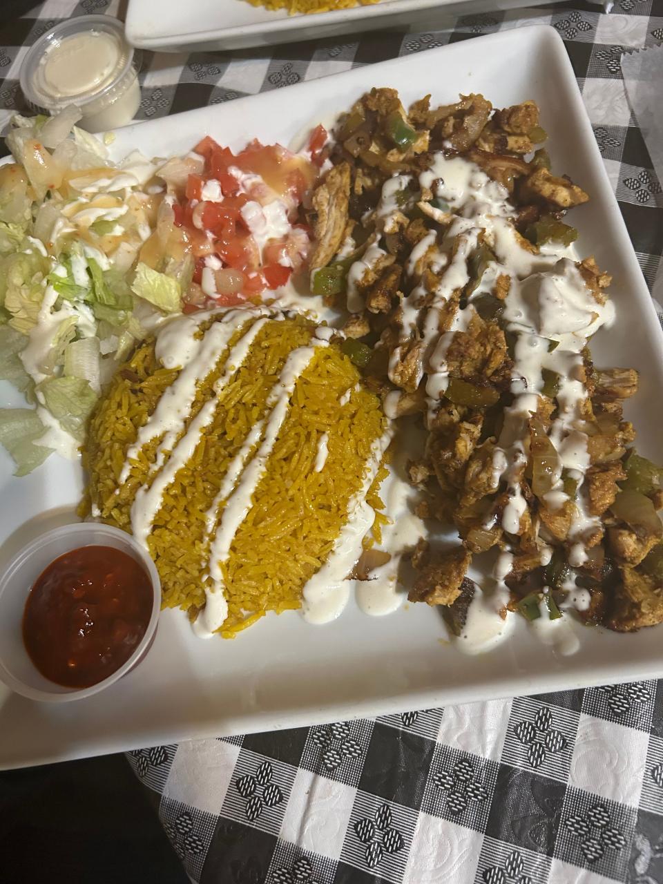 Halal chicken over rice is the top seller at Mid-East Cafe and Restaurant in Akron.
