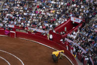 A bullfighter performs during a bullfight at the Plaza Mexico, in Mexico City, Sunday, Jan. 28, 2024. Bullfighting returned to Mexico City after the Supreme Court of Justice overturned a 2022 ban that prevented these events from taking place in the capital. (AP Photo/Fernando Llano)