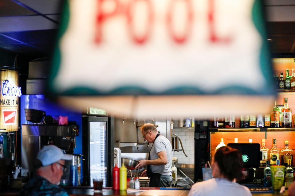 Matt Netzer, owner of the Dugout Bar & Grill, works in the kitchen on Tuesday, Aug. 1, 2023.