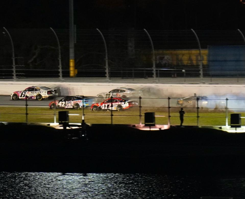 The 42 of Noah Gragson and the 41 of Ryan Preece get into the grass after a crash during the second Bluegreen Vacations Duel race on Thursday night.